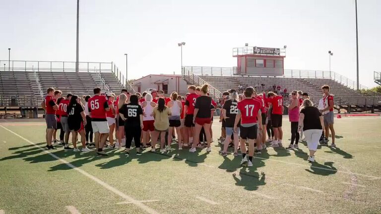 Moms of high school football players suit up for a practice prior to season debut