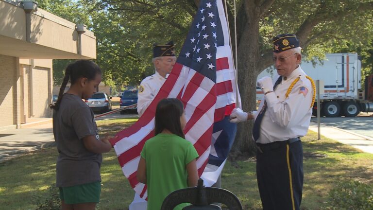 Johnson Elementary students learn how to properly raise flags