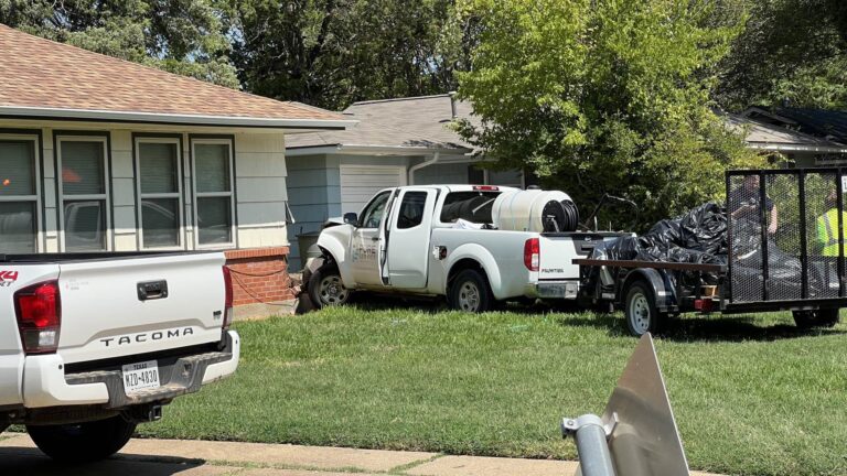 Driver sent to hospital after pickup truck clips corner of Bryan home