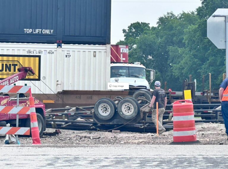 Intersection blocked after train hits trailer pulled by a pickup in Lyons