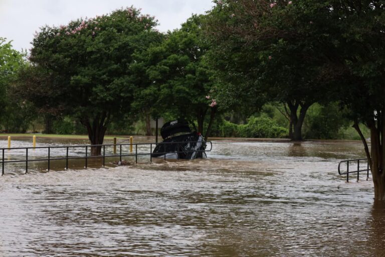 Vehicle captured on video driving into flooded creek